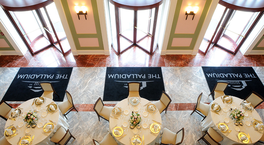 The South Lobby of the Palladium, accomodating circular dining tables for an elegant wedding.