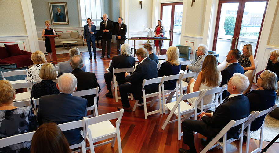 A philanthropic event takes place in the Founders Club.