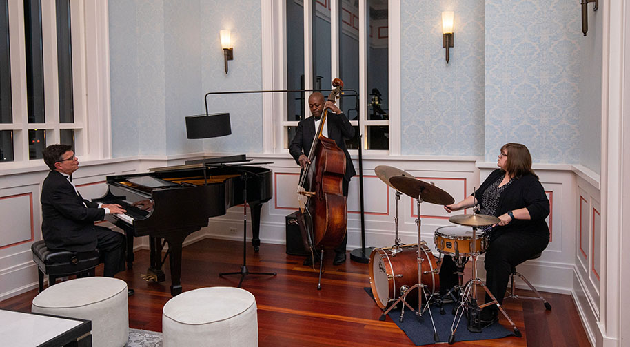 A jazz trio performs in the Founders Club during an after-party following the Center Celebration gala.