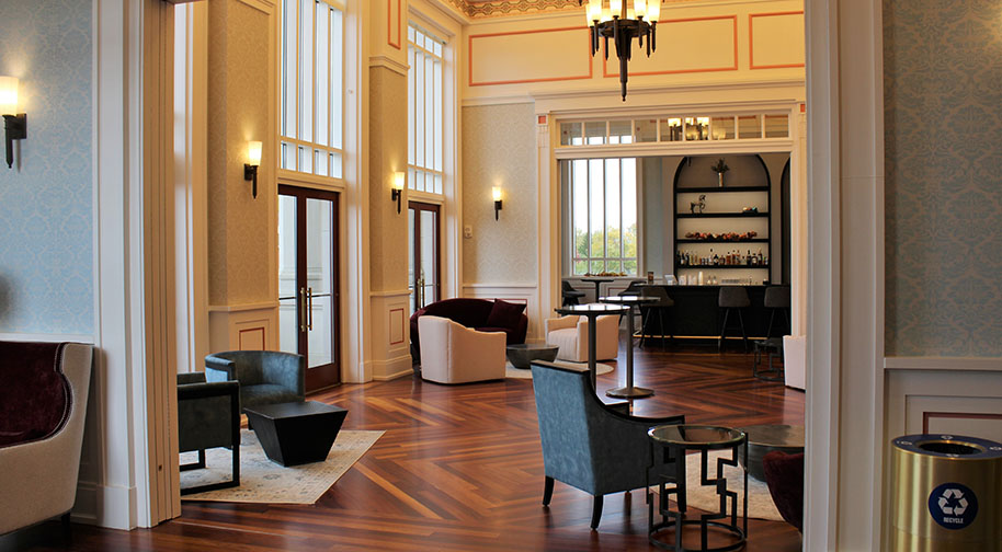 A view of the Founders Club from the South room shows comfortable seating and a full bar.