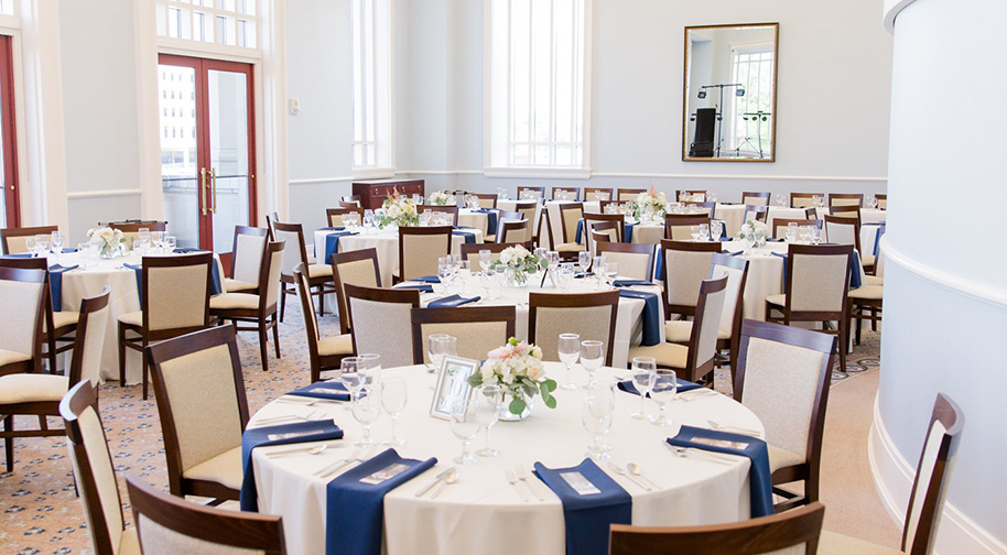 The Robert Adam Room in the Palladium filled with dining tables set for service.