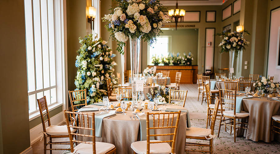 The Shiel Sexton Songbook Lounge at the top level of the Palladium is filled with tables and floral arrangements for a small, elegant wedding.