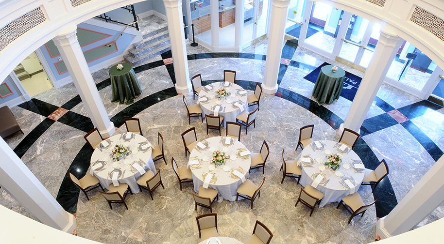 A view of the Palladium's East Lobby rotunda from above which is filled with dining tables.