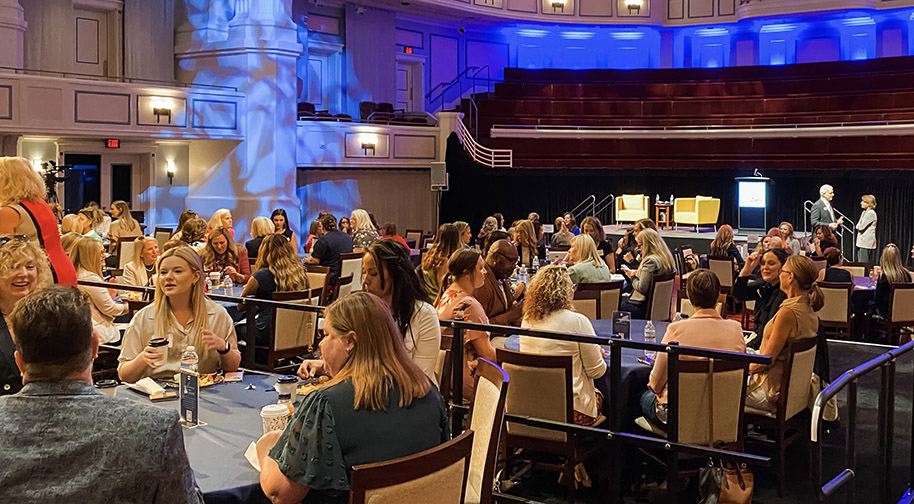 The festival floor covering seating in the Palladium accomodates dining tables for a party.