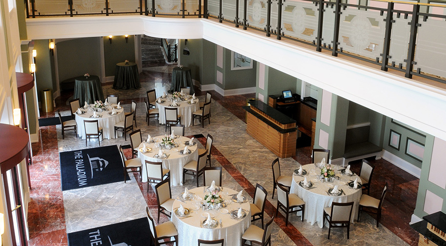 The Palladium's South Lobby filled with circular dining tables.