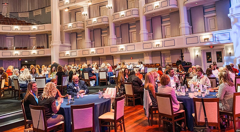 The festival floor covering seating in the Palladium accomodates dining tables for a party.