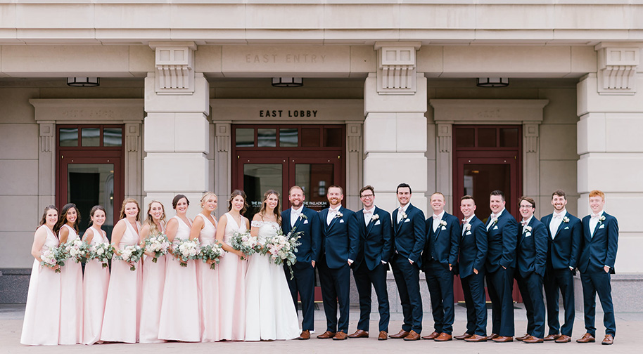 A wedding party poses for a photo outside the Palladium's East Lobby.