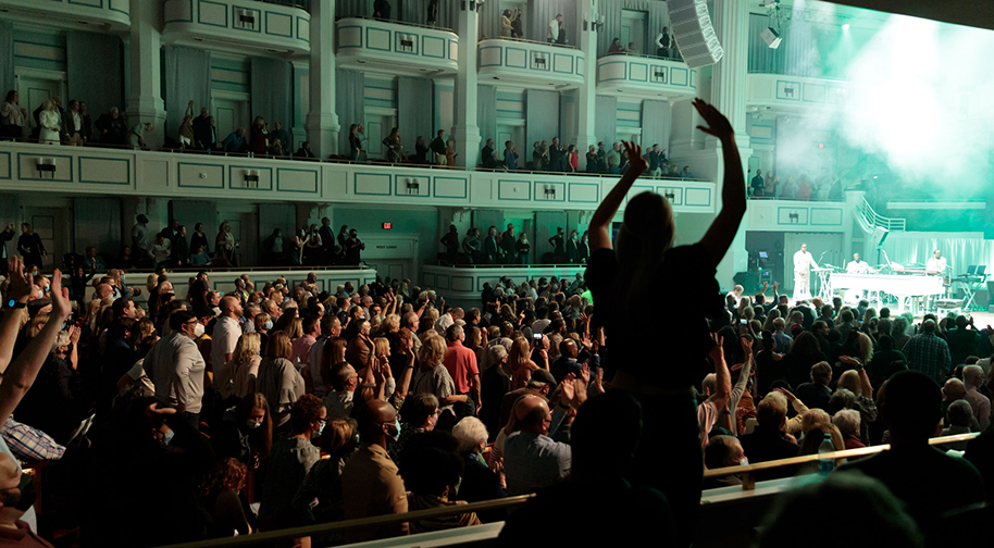 Audience members applaud following a concert in the Palladium.