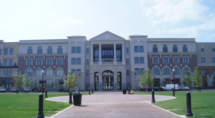 The four-story brick and limestone James Building viewed from the north across Carter Green.