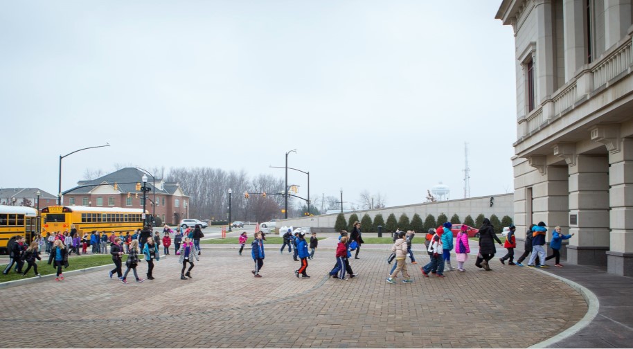 Students and teachers exit buses and enter the Palladium's West entrance for a school performance.