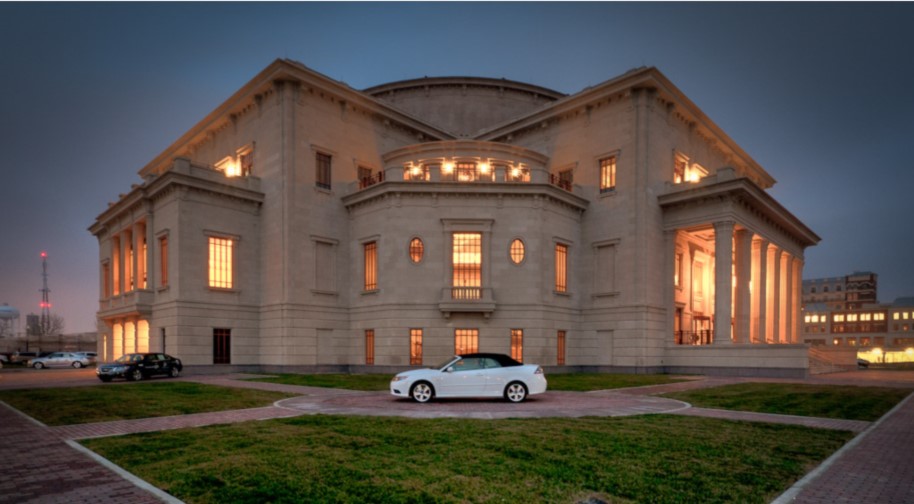 Palladium windows glow against the night sky.