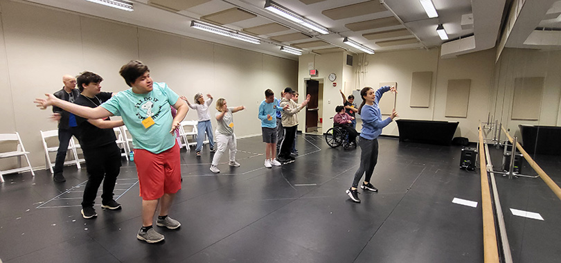 Prism Project performers rehearse together in a dance studio.