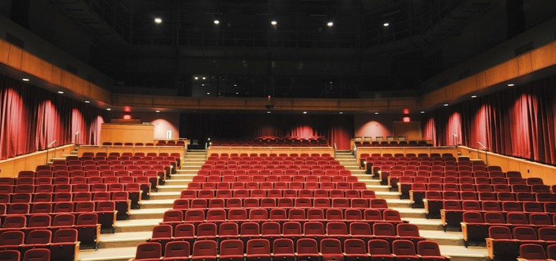 A view from the stage of red upholstered stadium seating at the Tarkington, a 500-seat theater.