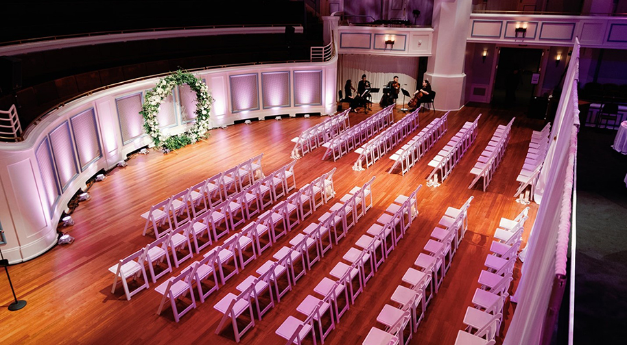 A simple, elegant wedding arrangement on the Palladium stage.